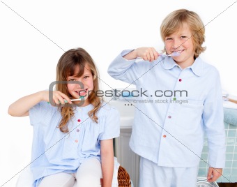 Cute children brushing their teeth