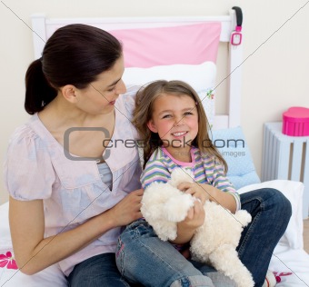 Happy mother and her daughter having fun 