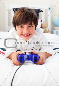 Happy boy playing video games 