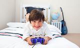 Cute little boy playing video games 