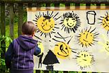 baby paints the sun outdoor
