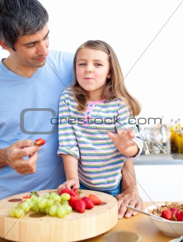 Little girl and her father having breakfast
