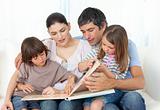 Attentive parents reading with their children 