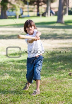 Lively little boy playing baseball