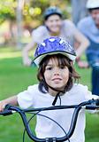 Adorable little boy riding a bike