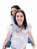 Lively mother giving her daughter piggyback ride 