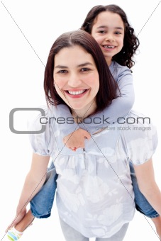 Close-up of mother giving her daughter piggyback ride