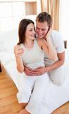 Enamored couple finding out results of a pregnancy test 