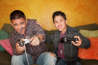 Hispanic Man and Boy Playing Video game