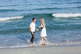 Enamoured couple walking at the seaside