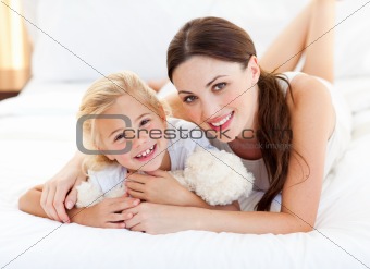 Portrait of a smiling mother and her little girl 