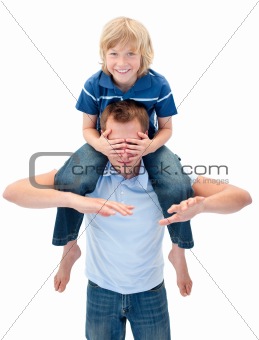 Joyful father giving his son piggyback ride