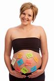 Happy pregnant woman with sticky notes on belly