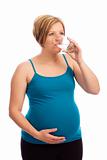 Healthy pregnant Caucasian woman drinking water