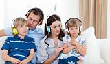 Young family listening music together 