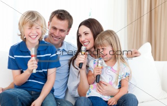 Laughing family singing together