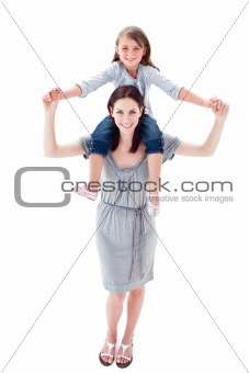 Attractive mother giving her daughter piggyback ride