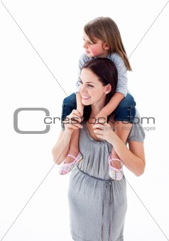 Beautiful mother giving her daughter piggyback ride