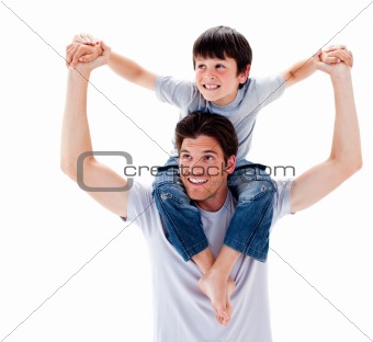 Close-up of father giving his son piggyback ride