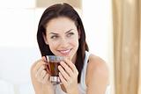 Attractive woman drinking tea