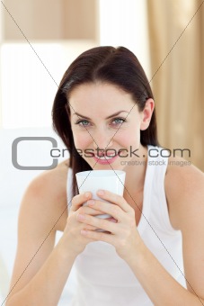 Bright woman drinking a coffee 