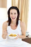 Attractive young woman having breakfast 