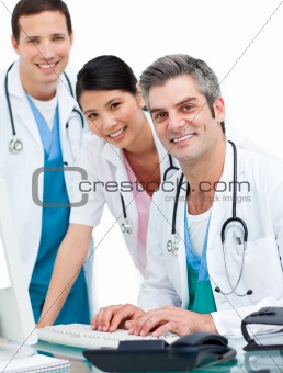 Medical team working at a computer