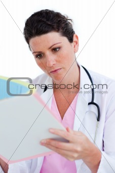 Portrait of nurse reading documents