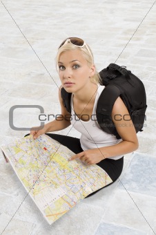 young blond tourist sitting