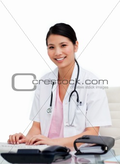 Female doctor working on computer