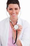 Brunette nurse holding a stethoscope