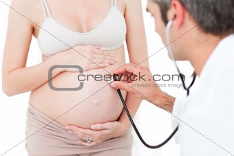 Gynecologist examining a pregnant woman