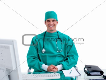 Portrait of a young doctor working at a computer