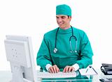 Smiling doctor working at a computer