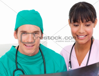 Two  confident doctors looking at an X-ray 