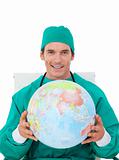 Confident doctor holding terrestrial globe