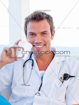 Smiling doctor having a break
