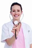 Portrait of a smiling female doctor holding a stethoscope