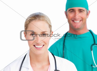Blond female doctor and smiling surgeon