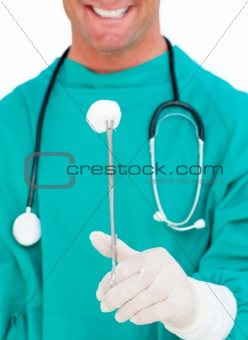 Close-up of surgeon holding surgical forceps