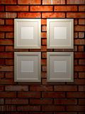 Picture frames on a brick wall