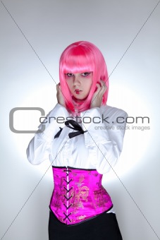 Young surprised woman dressed in oriental corset 