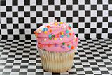 shot of a cupcake on checkered background 