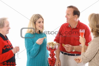 shot of people at a party enjoying snacks