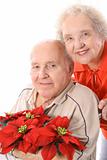 shot of an eldery couple with flowers vertical