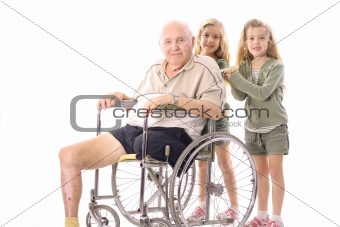 shot of twin sisters pushing eldery man in wheelchair