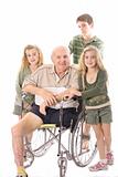 shot of Grandchildren with handicap Grandfather in wheelchair