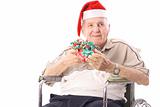 shot of an eldery man in wheelchair celebrating christmas 