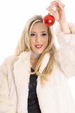 shot of a Gorgeous blonde in fur holding an christmas ornament