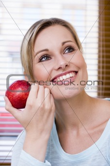 Beautiful Healthy Woman Holding an Apple